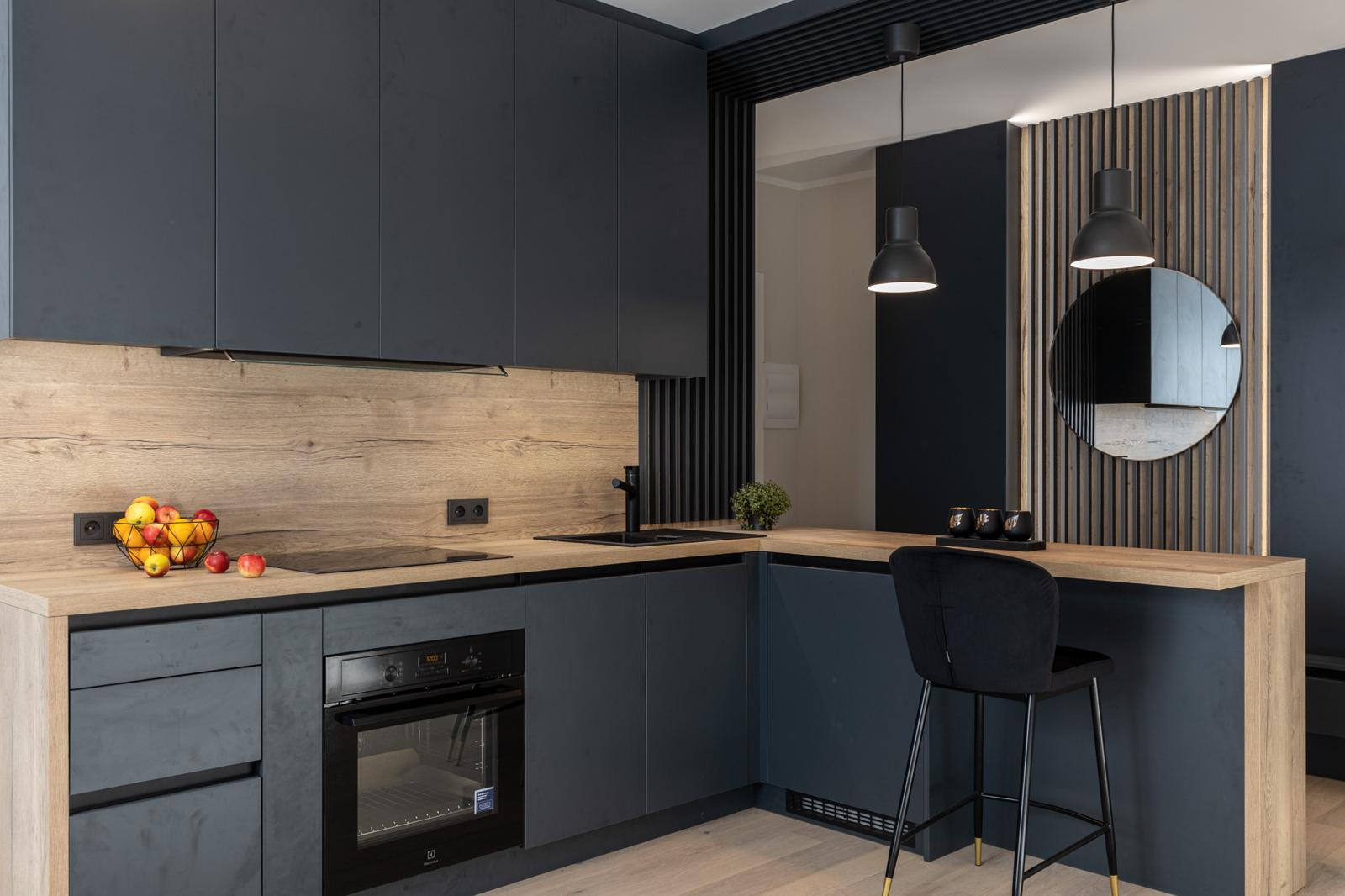 Contemporary kitchen with dark cabinets